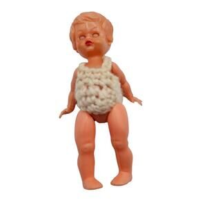 vintage Redbox hard plastic baby doll, likely from the 1950s to early 1980s